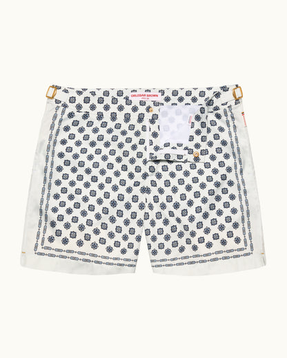 White shorts with blue geometric pattern on a white background