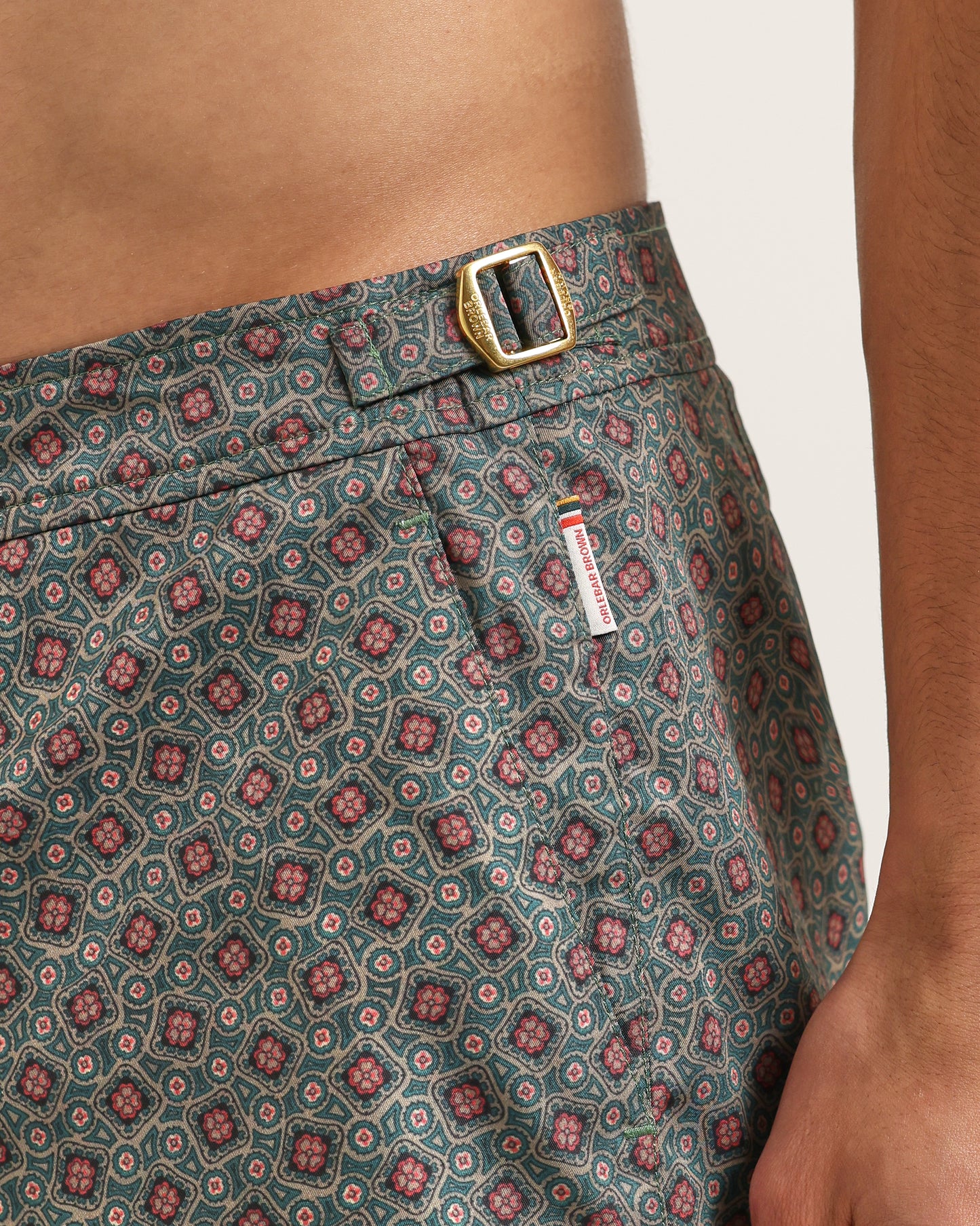 Patterned shorts with a visible brand tag on a neutral background