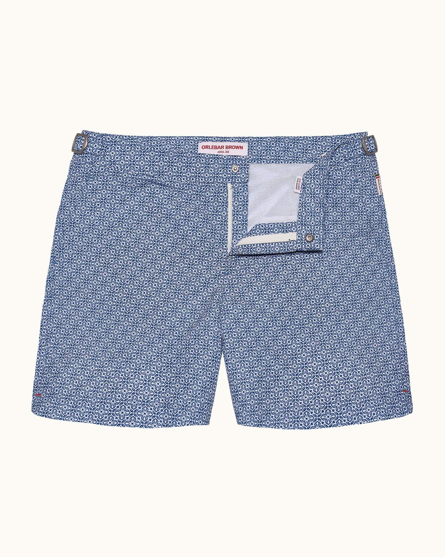 Blue patterned shorts with a white pocket on a white background