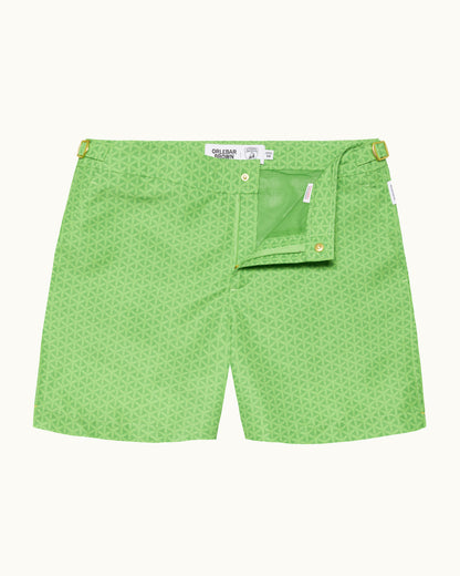 Green patterned shorts on a white background