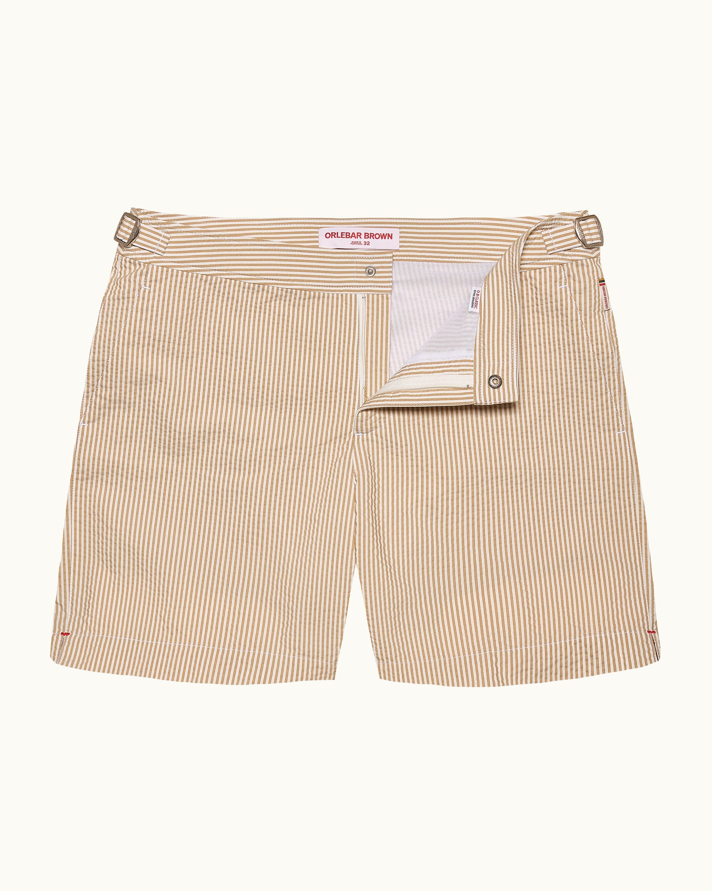 Beige striped shorts with a visible brand label on a white background