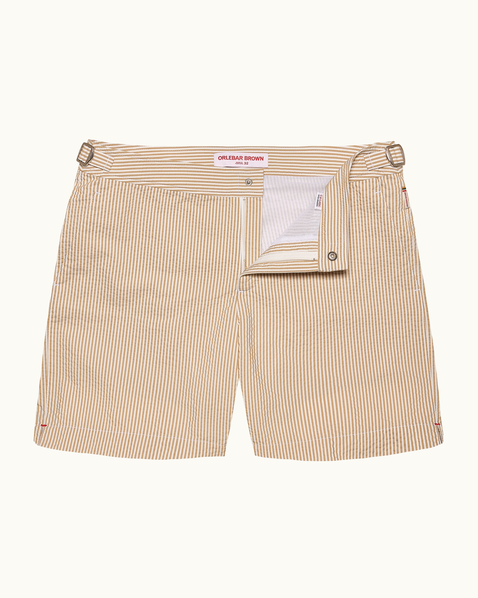 Beige striped shorts with a visible brand label on a white background