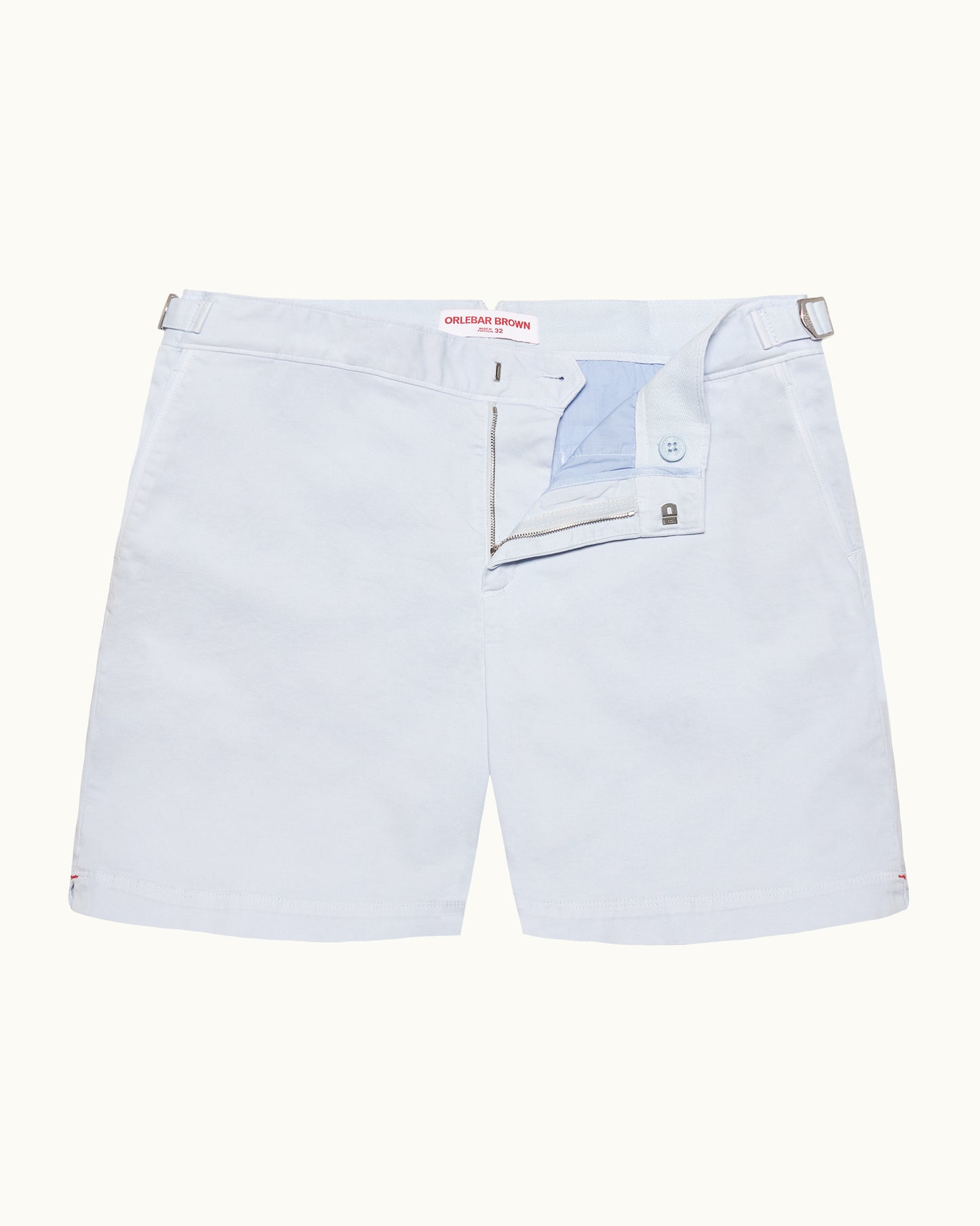 Light blue shorts with a brand label on a white background