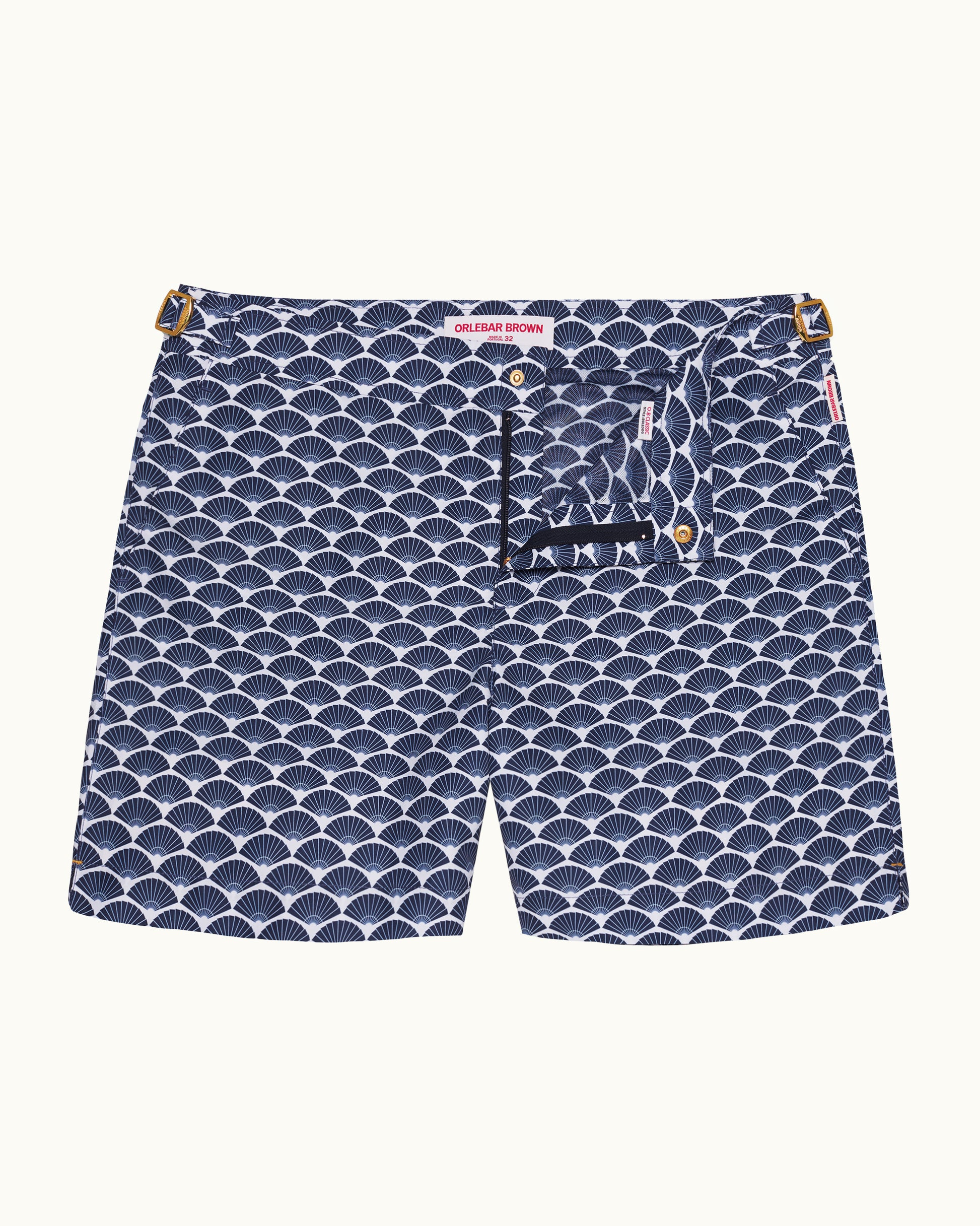 Navy blue swim shorts with white wave pattern on a white background
