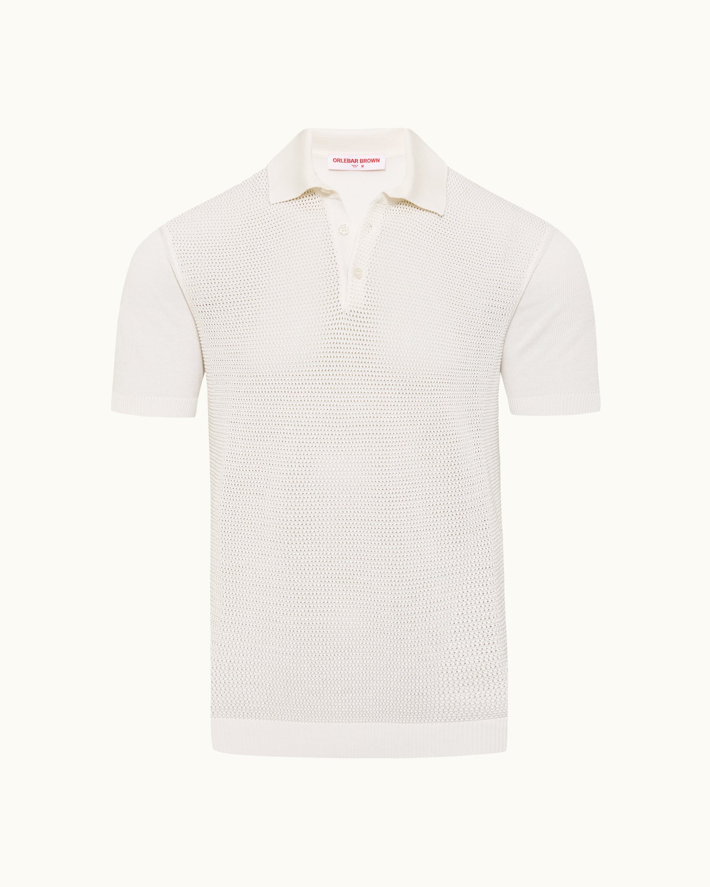 White polo shirt with textured knit on a plain background