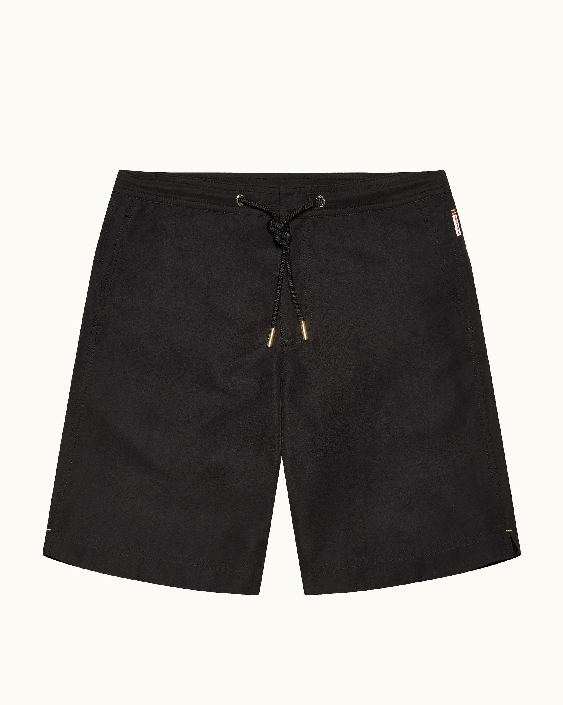 Black drawstring waist swim shorts on a plain background