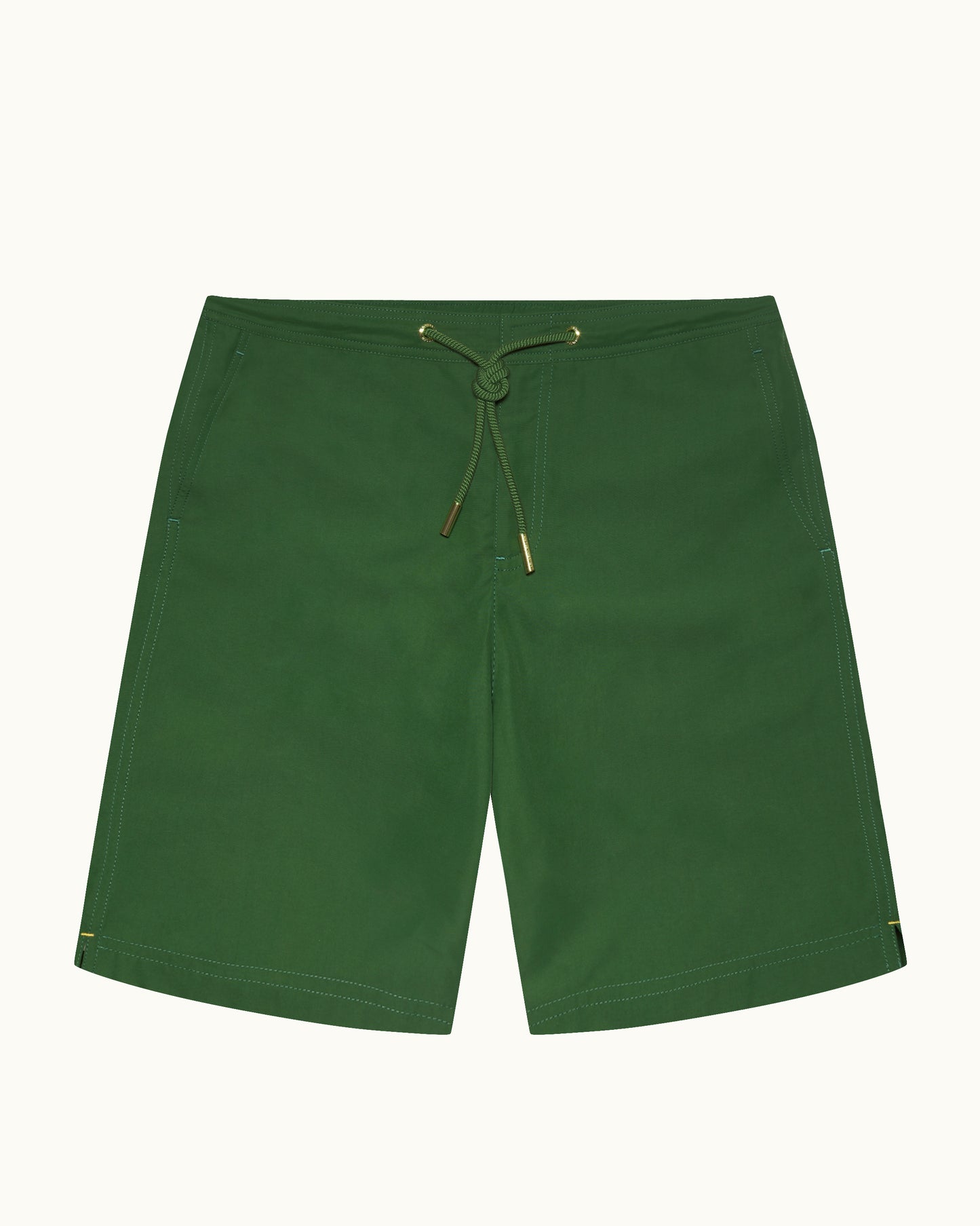 Green shorts with a drawstring on a white background