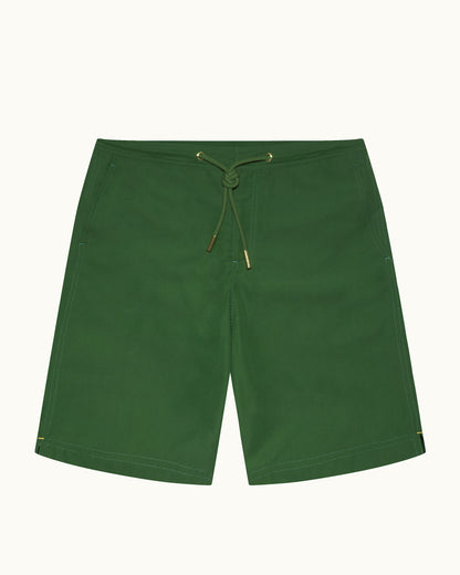 Green shorts with a drawstring on a white background