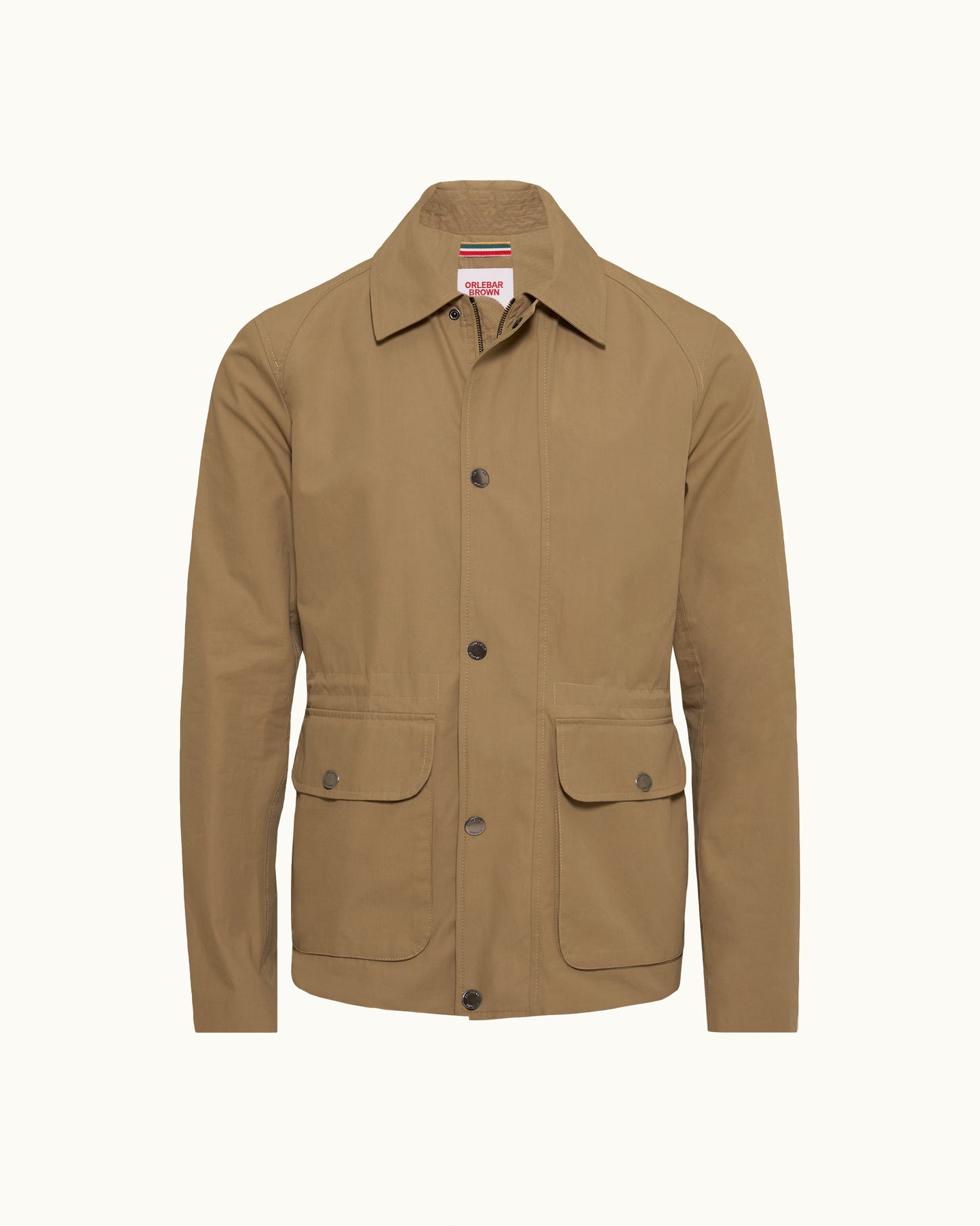 A tan utility jacket with a pointed collar, dark snap buttons, and two front flap pockets, shown on a plain off-white background.