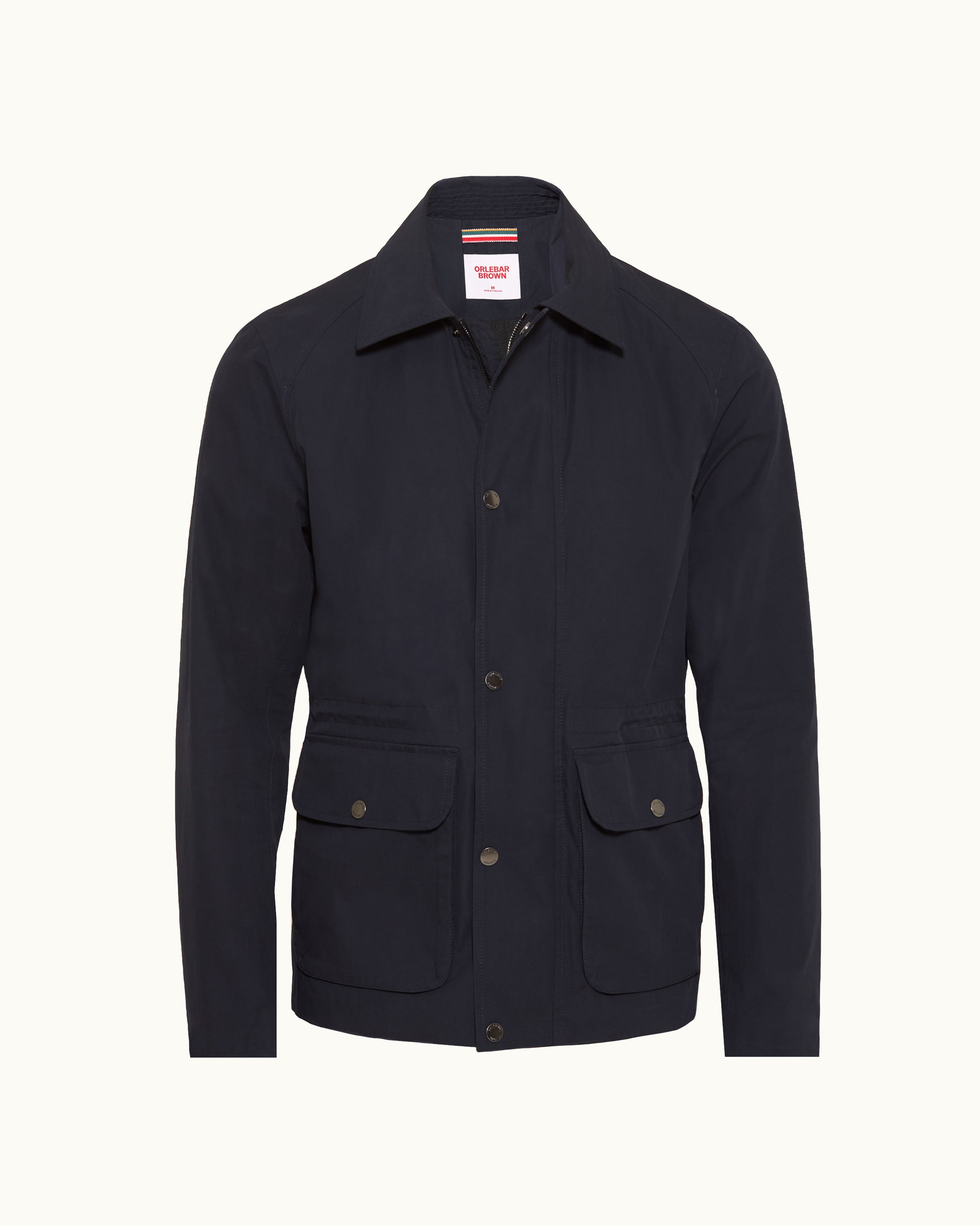 A dark navy blue utility jacket with a pointed collar, button front, and two front flap pockets, shown on a clean off-white background.
