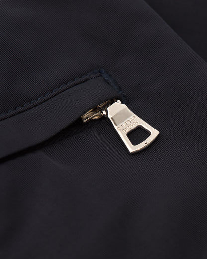 Close-up of a zipper on a dark fabric background