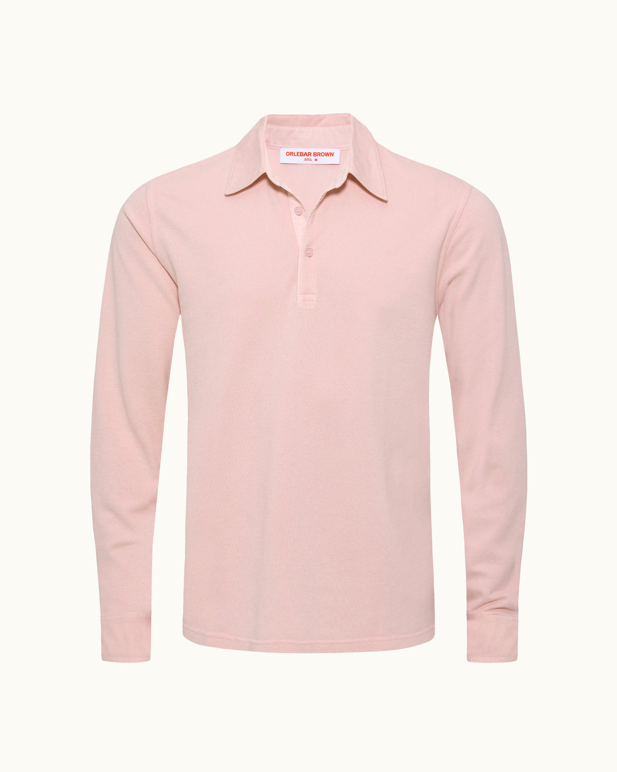 A light pink long-sleeve polo shirt with a buttoned collar, displayed on a clean, off-white background.