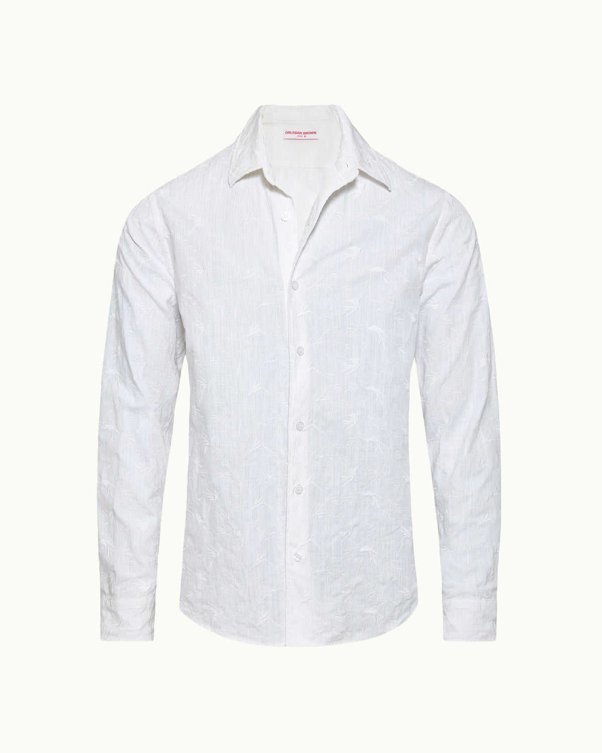 White linen long-sleeved shirt on a plain background