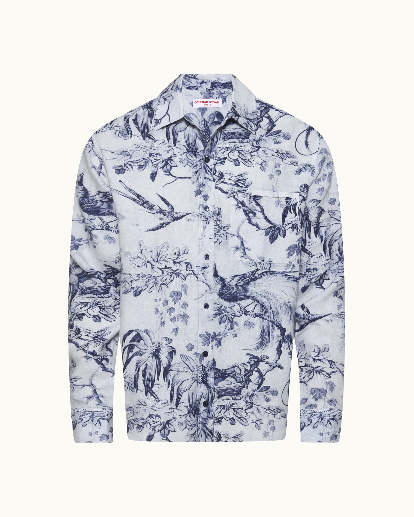 White shirt with blue floral and nature pattern on a white background
