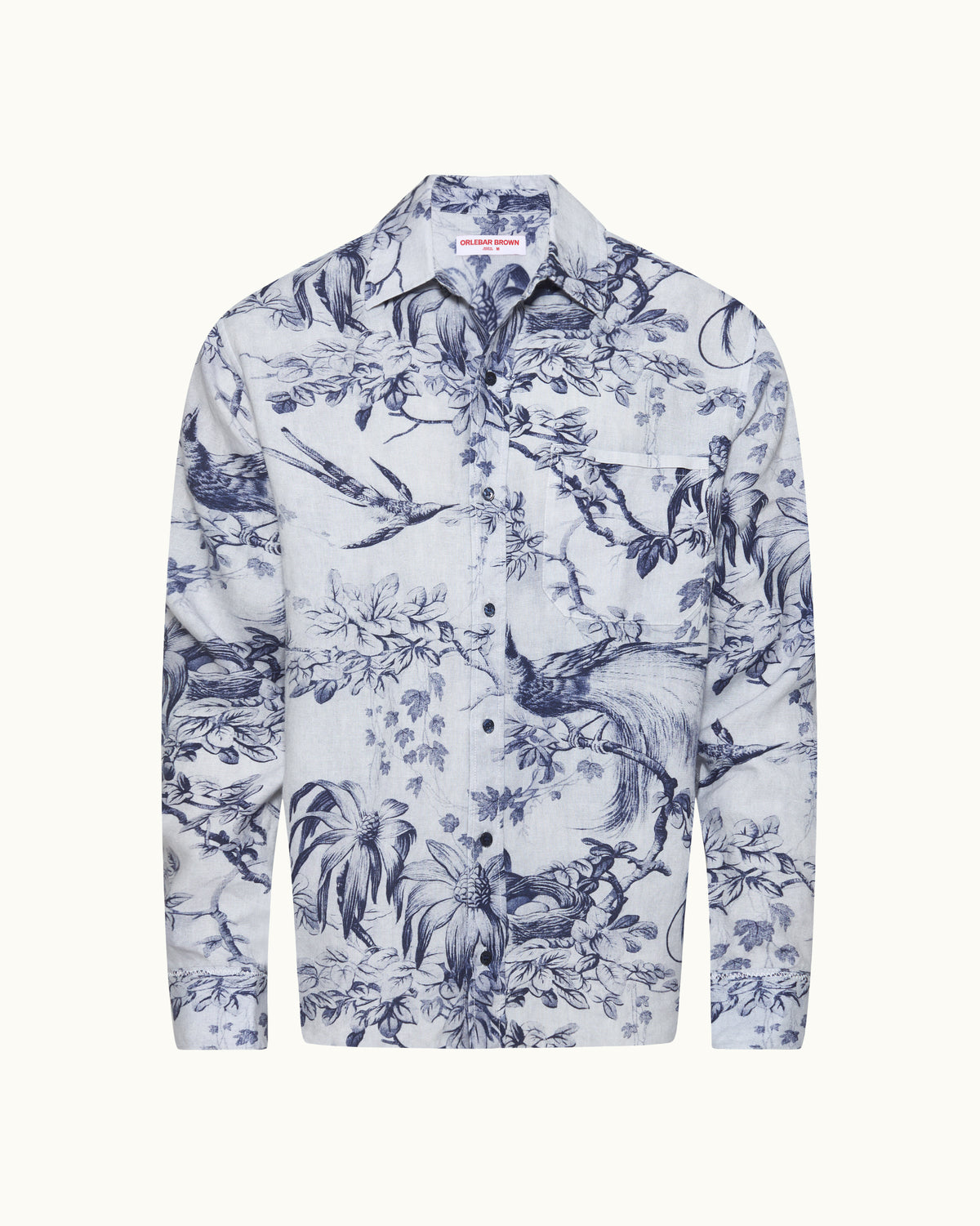 White shirt with blue floral and nature pattern on a white background