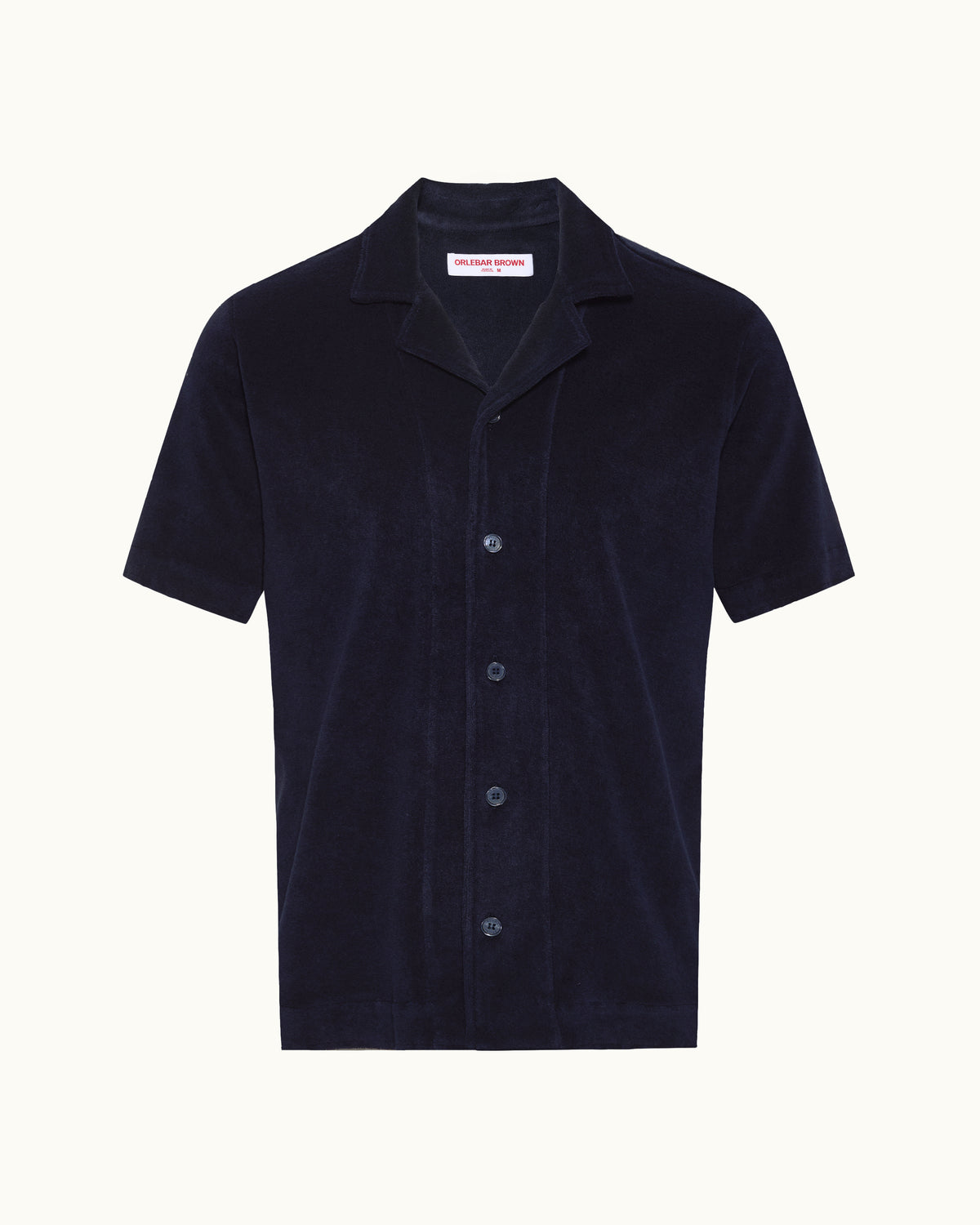 Navy short sleeve towelling shirt on a plain background