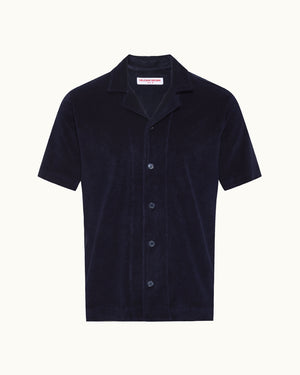 Navy short sleeve towelling shirt on a plain background