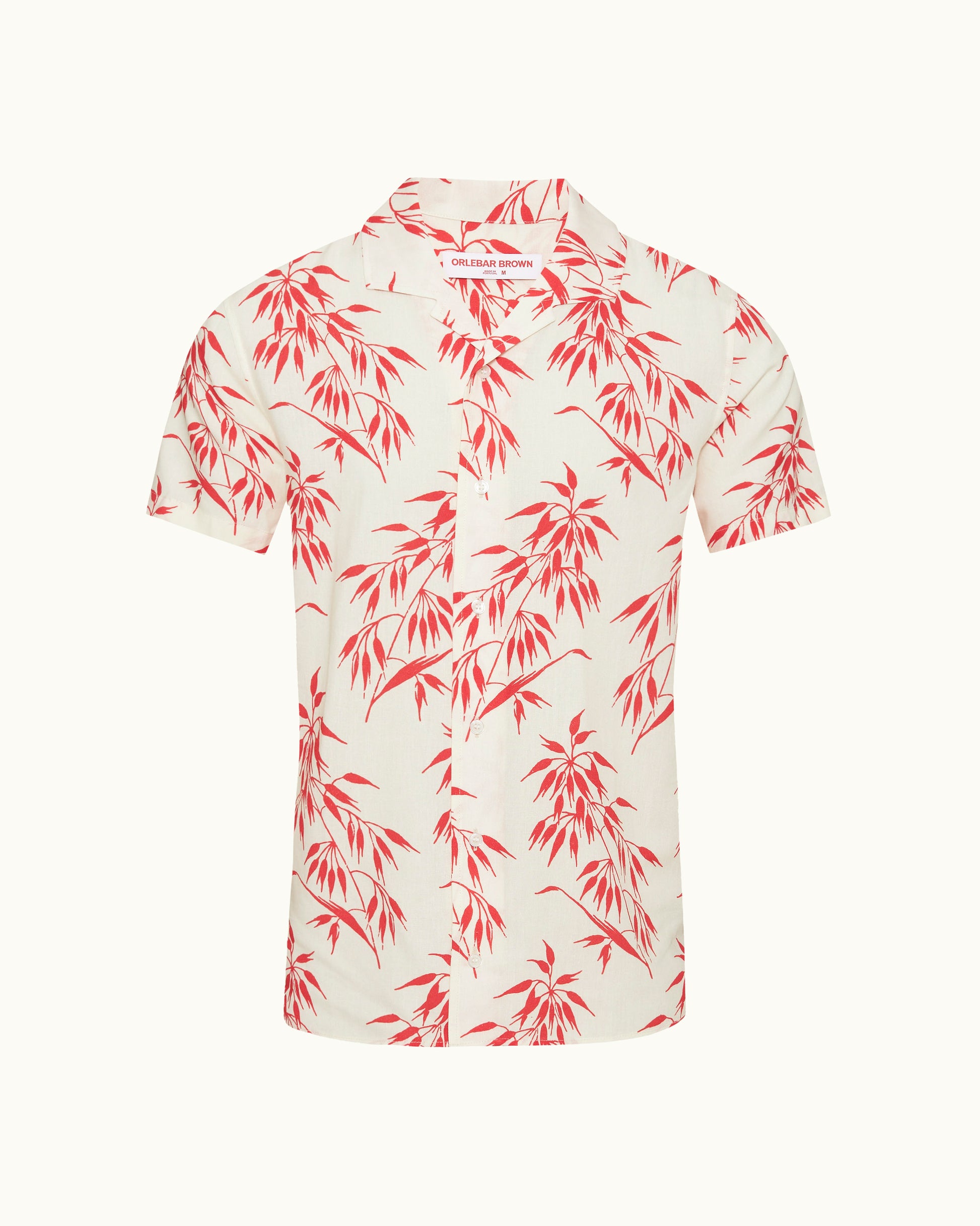 White shirt with red floral pattern on a white background