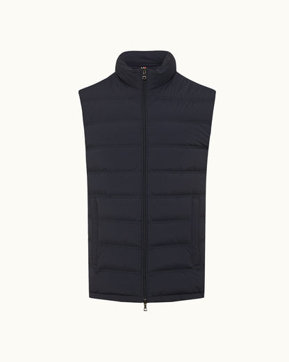 Black puffer vest on a white background