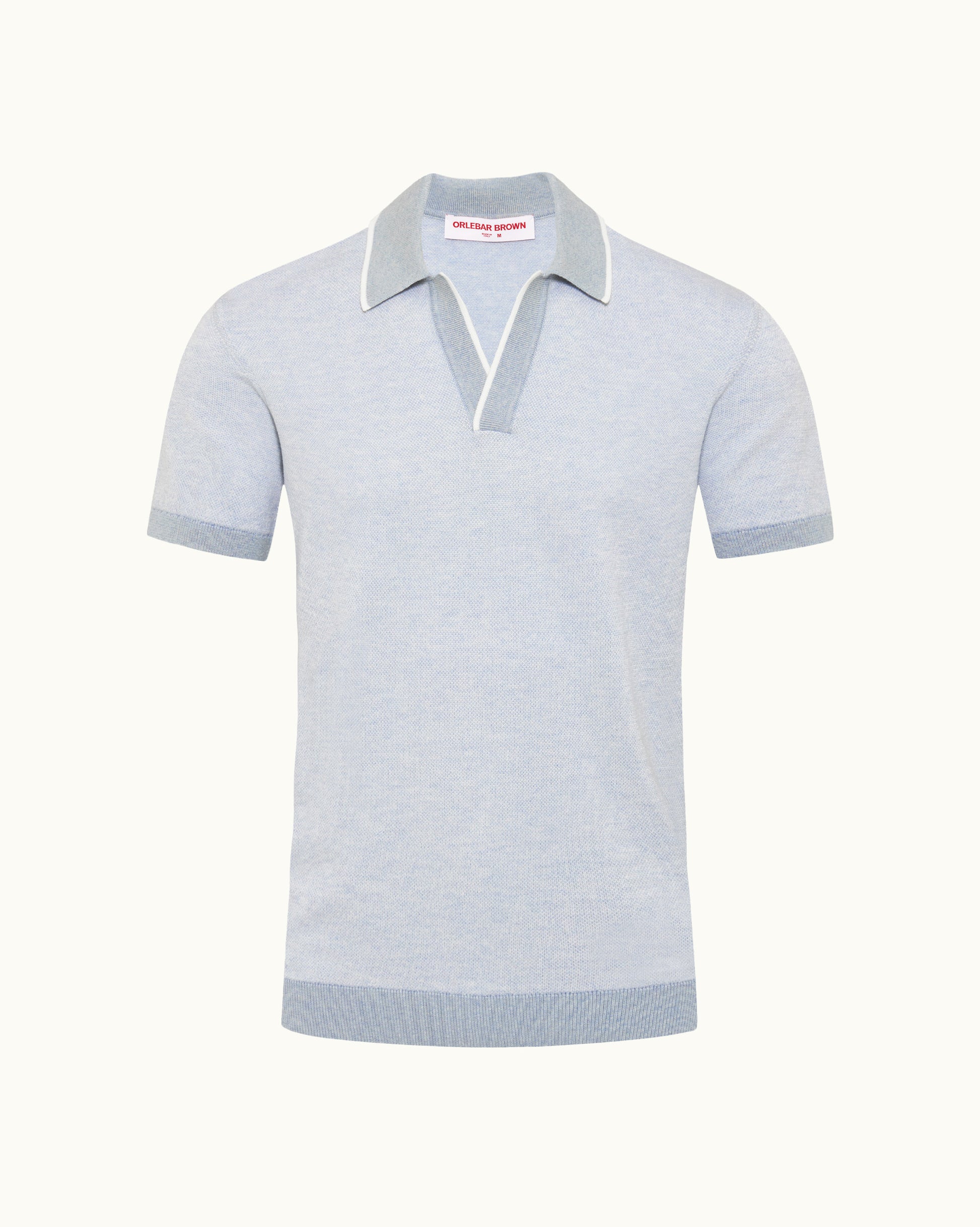 Light blue polo shirt with white collar on a white background
