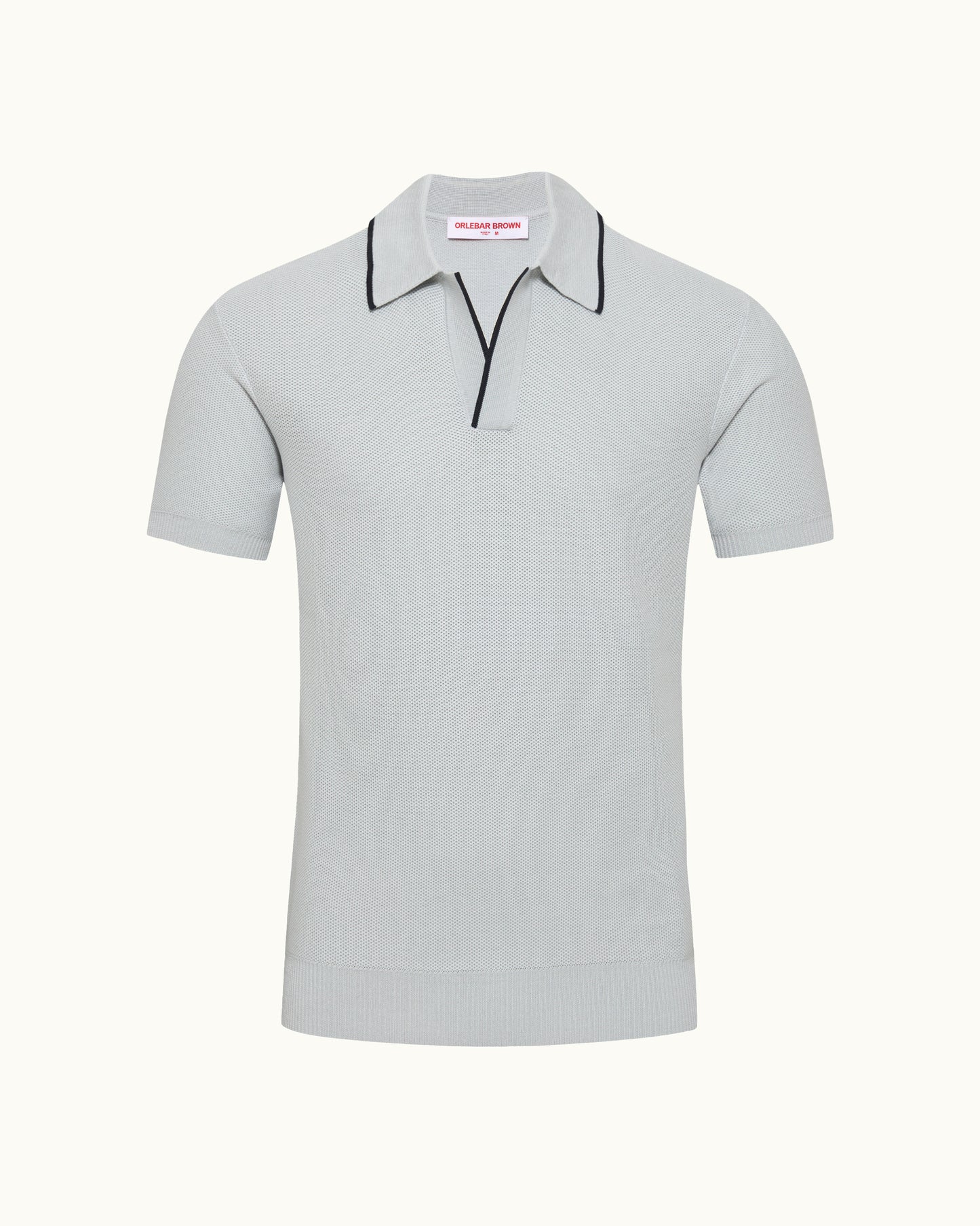 Light blue polo shirt with black trim on a white background