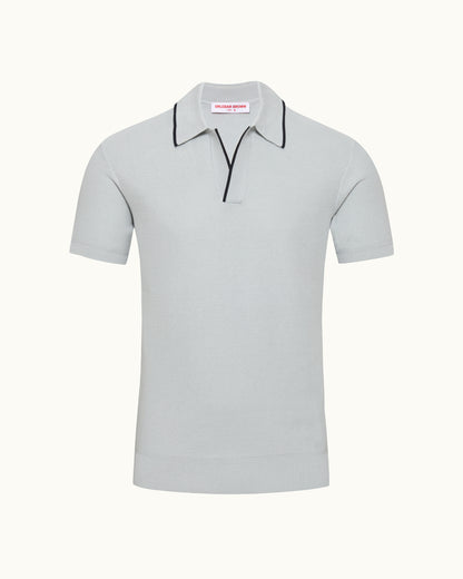 Light blue polo shirt with black trim on a white background