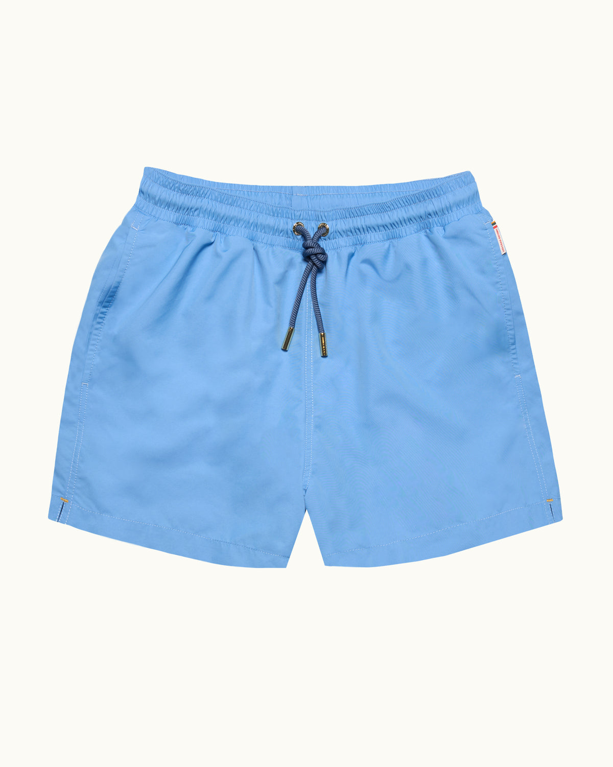 Bright blue drawcord swim shorts on a plain background