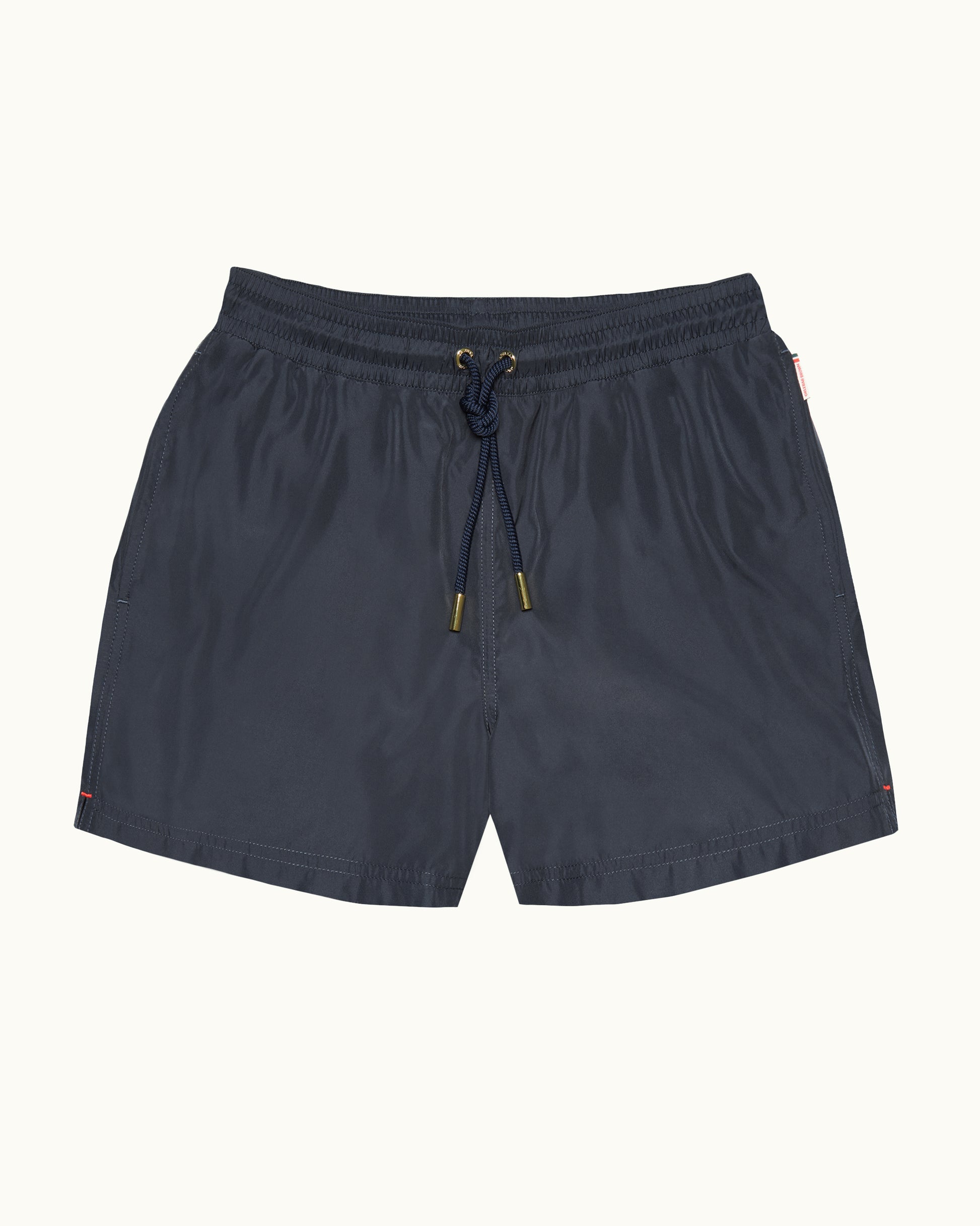 Navy blue shorts with drawstring on a white background