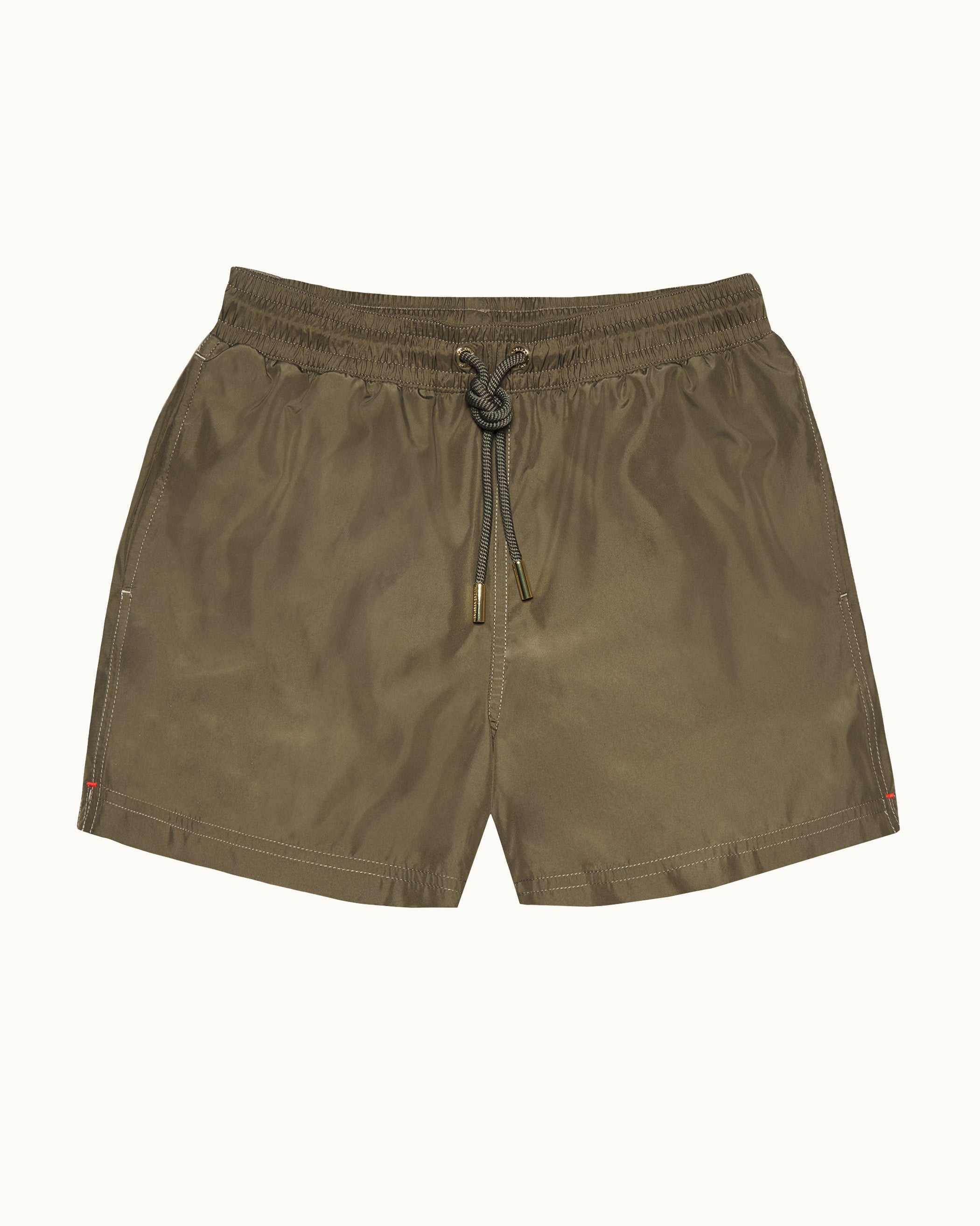 Olive green shorts with a drawstring on a white background