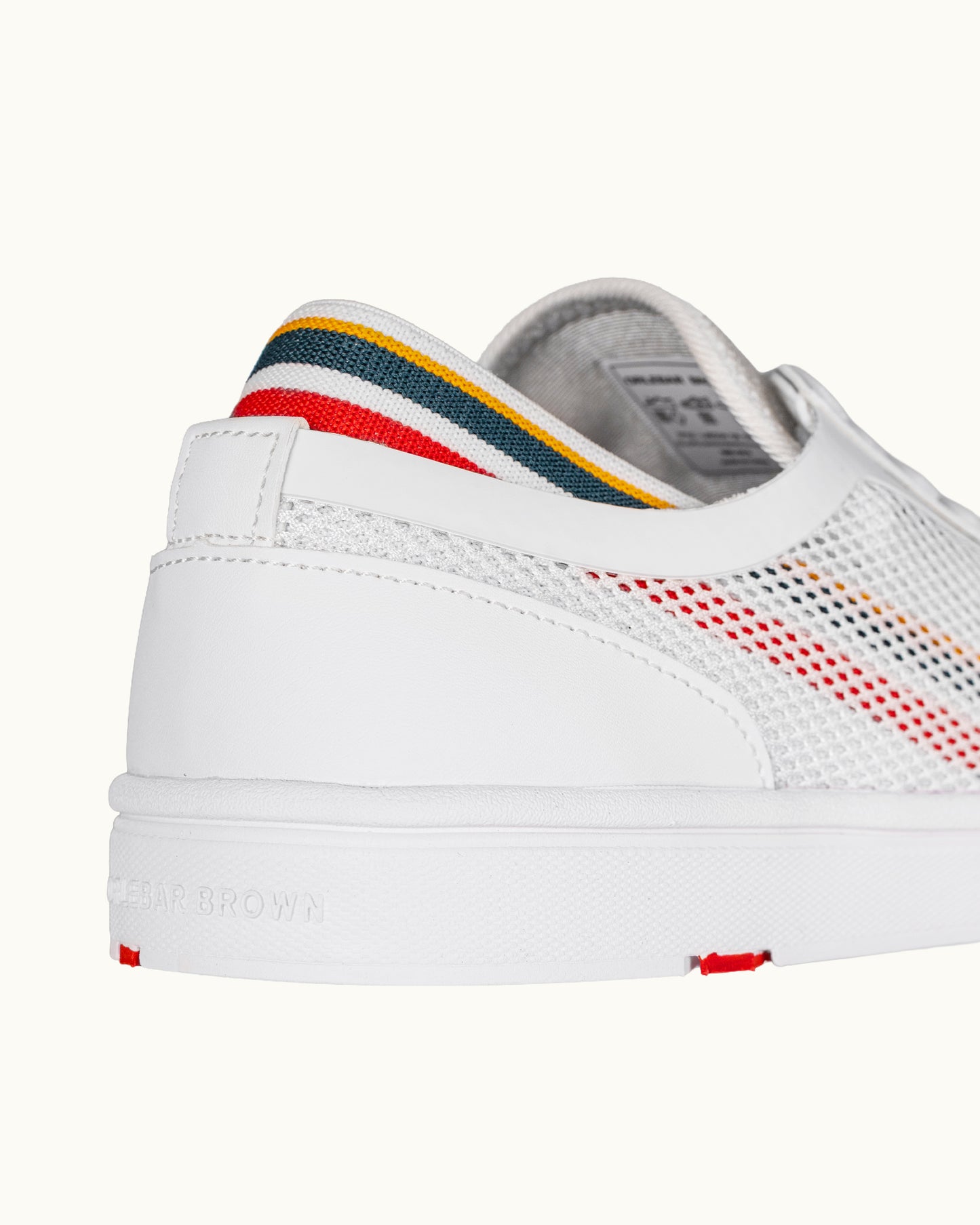White sneaker with colorful accents on a white background