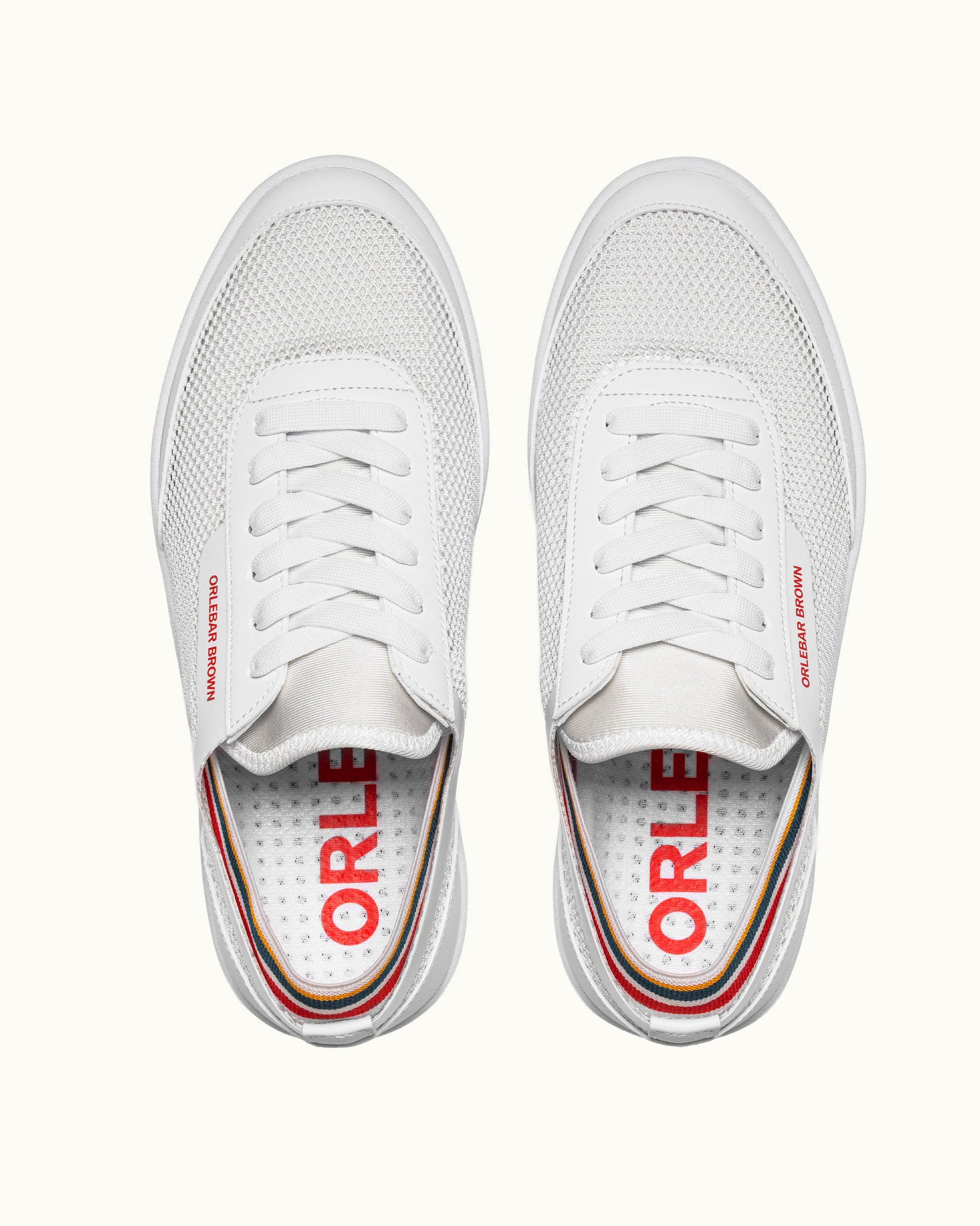 White sneakers with 'Orlebar Brown' branding on a white background