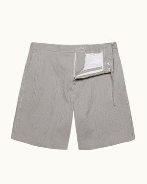 A pair of light gray pinstriped shorts with a white interior lining visible at the front opening, shown flat against a light off-white background.