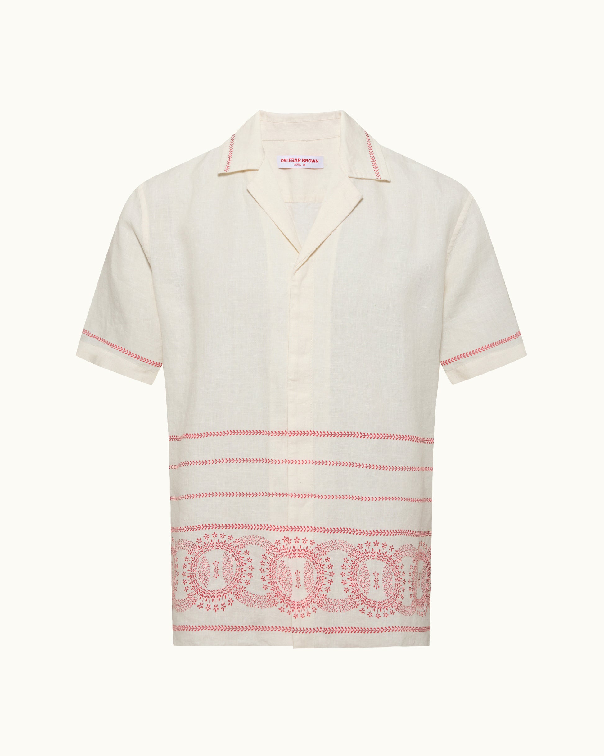 White shirt with red patterns on a white background