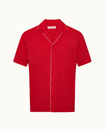 Red short-sleeve shirt with white trim on a white background