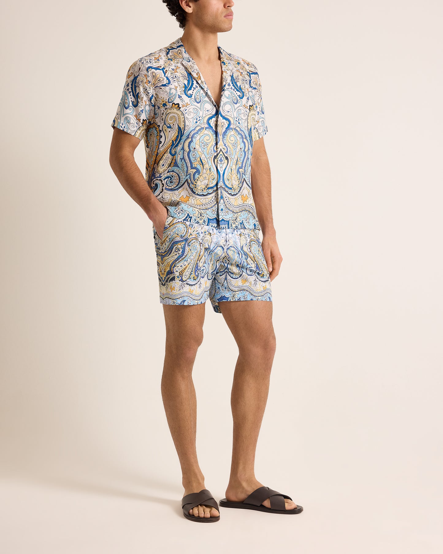 Person wearing a patterned set on a plain background