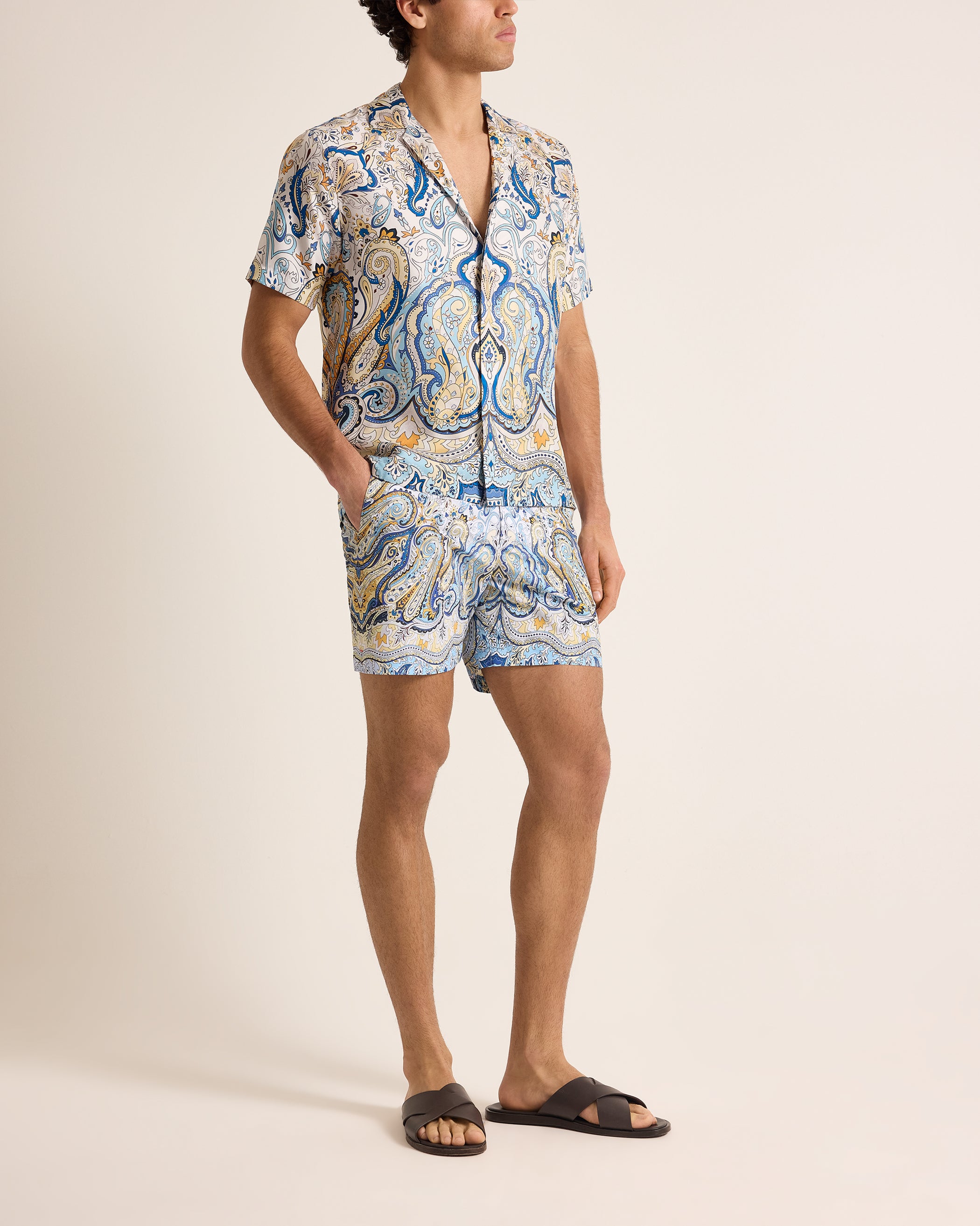 Person wearing a patterned set on a plain background
