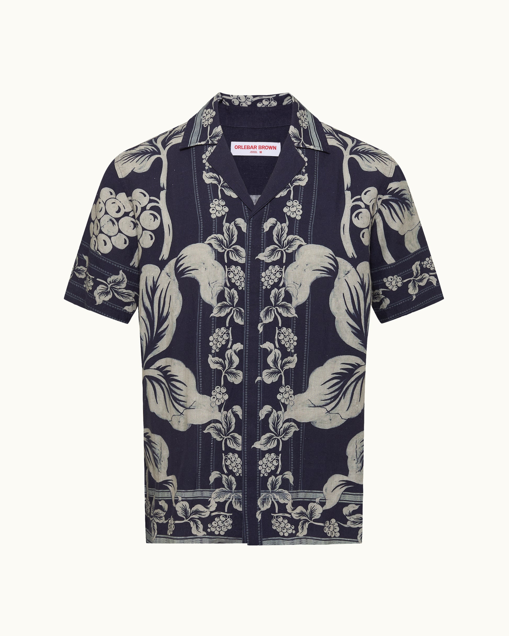 Navy blue shirt with white floral pattern on a white background