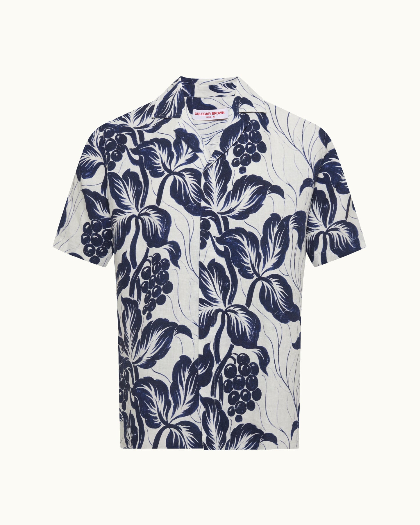 White shirt with navy blue floral pattern on a white background