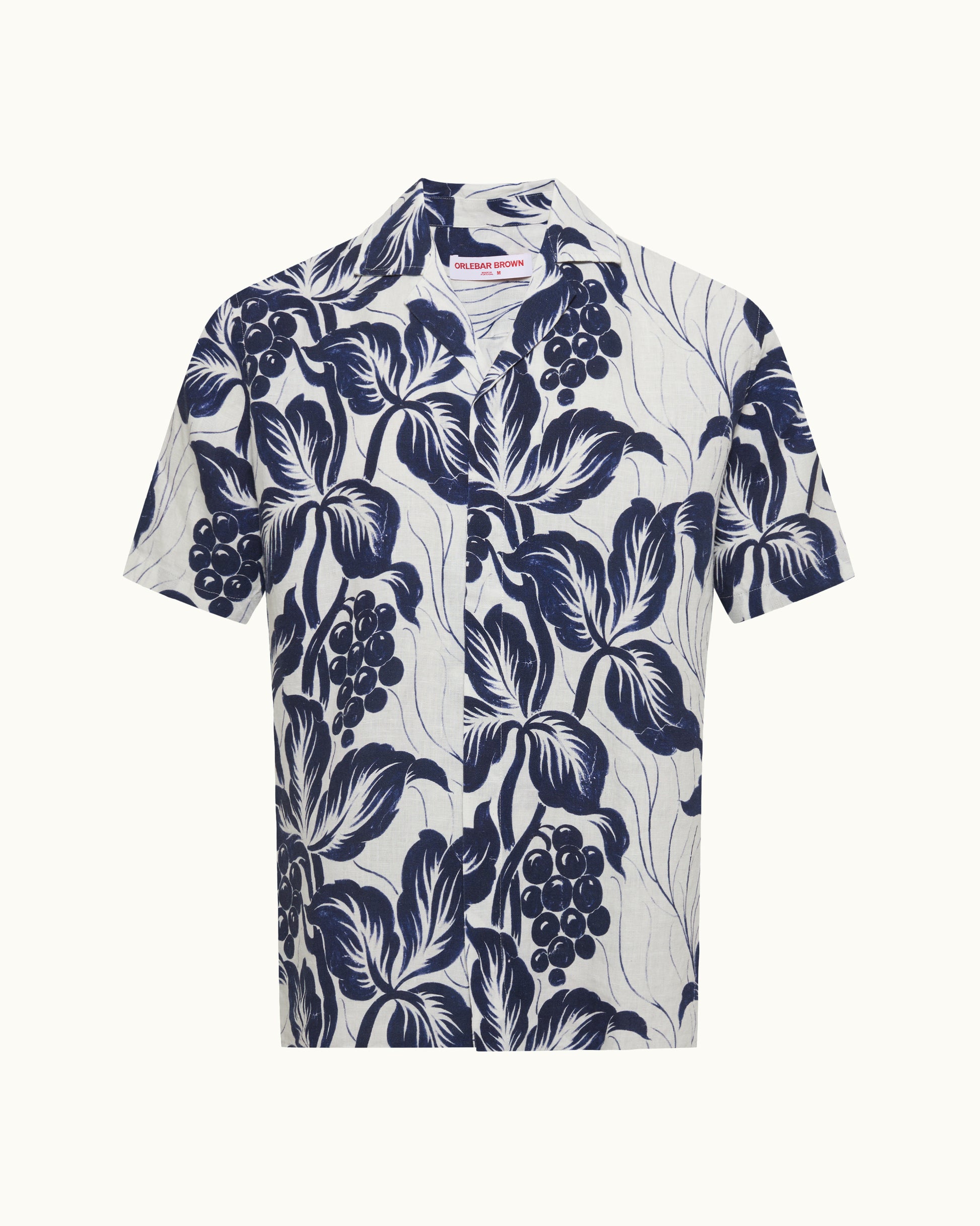 White shirt with navy blue floral pattern on a white background