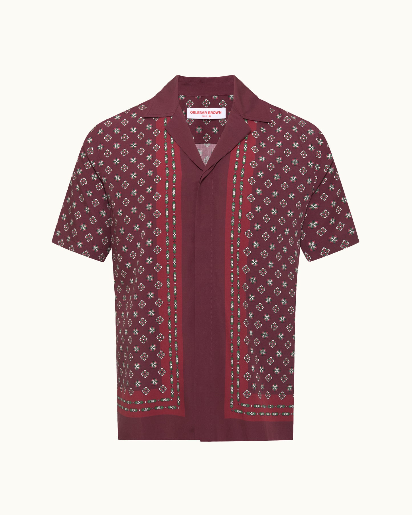 Maroon short-sleeve shirt with a pattern on a white background