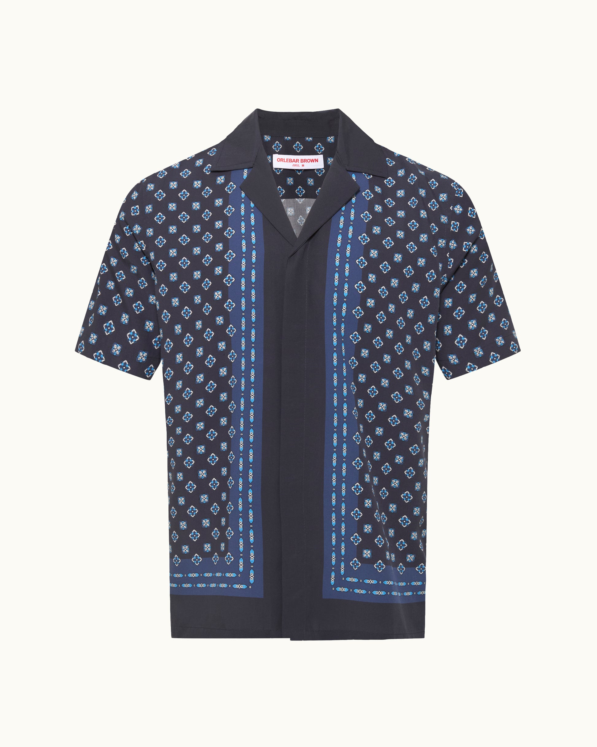 Navy patterned shirt with a collar on a white background