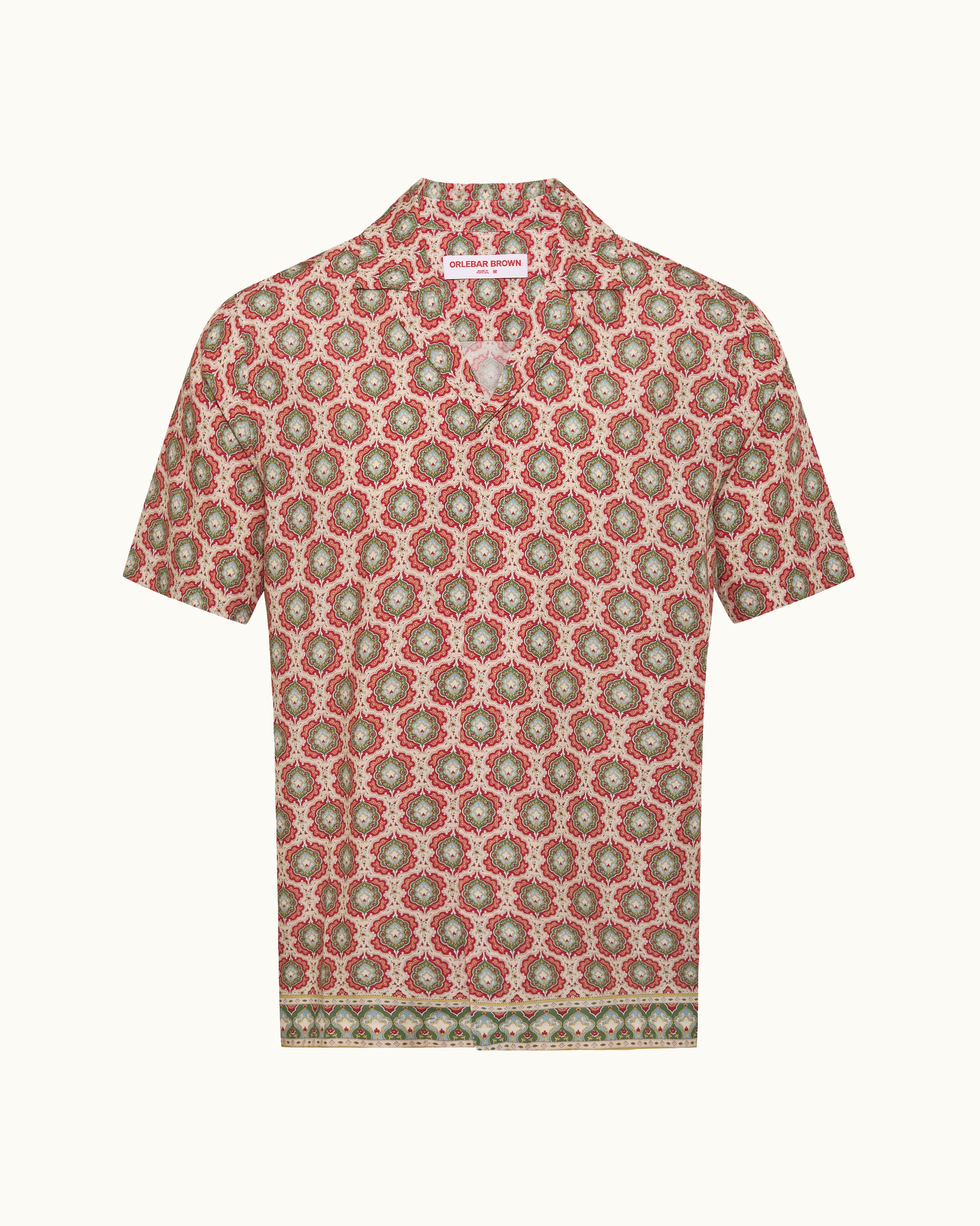 Short-sleeve shirt with a red and green floral pattern on a white background