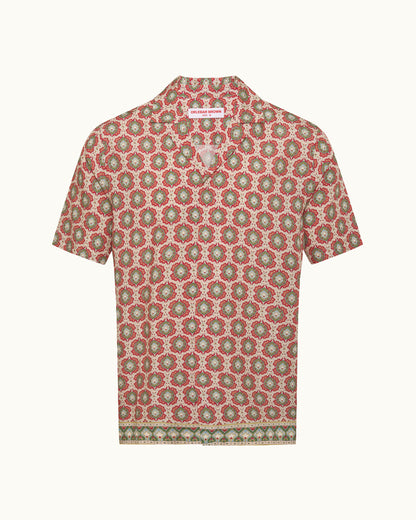 Short-sleeve shirt with a red and green floral pattern on a white background