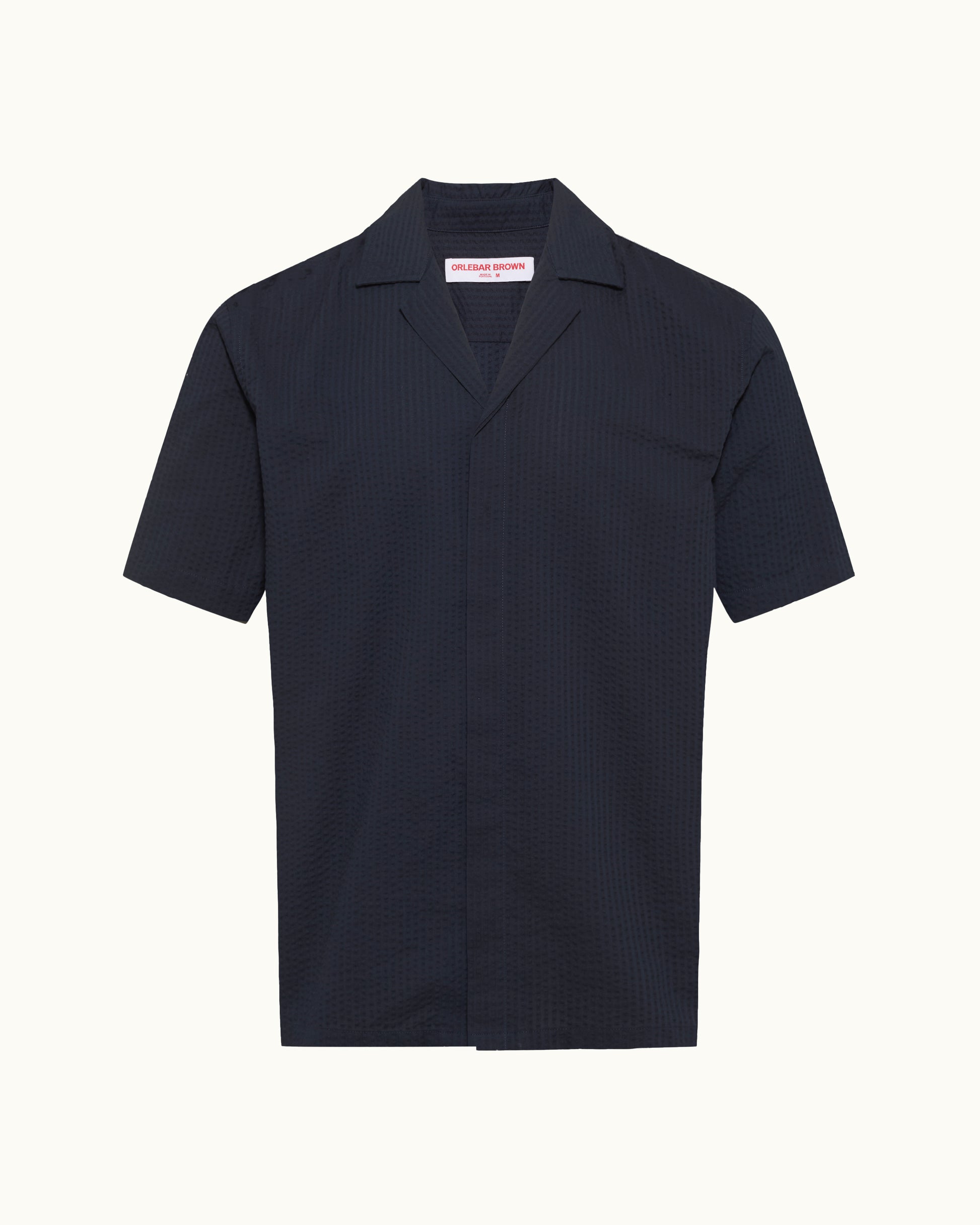 Navy blue short-sleeve shirt on a white background