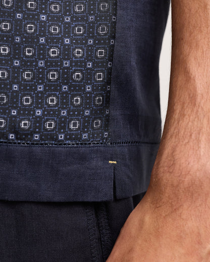 Close-up of vavy patterned short-sleeve shirt on a white background