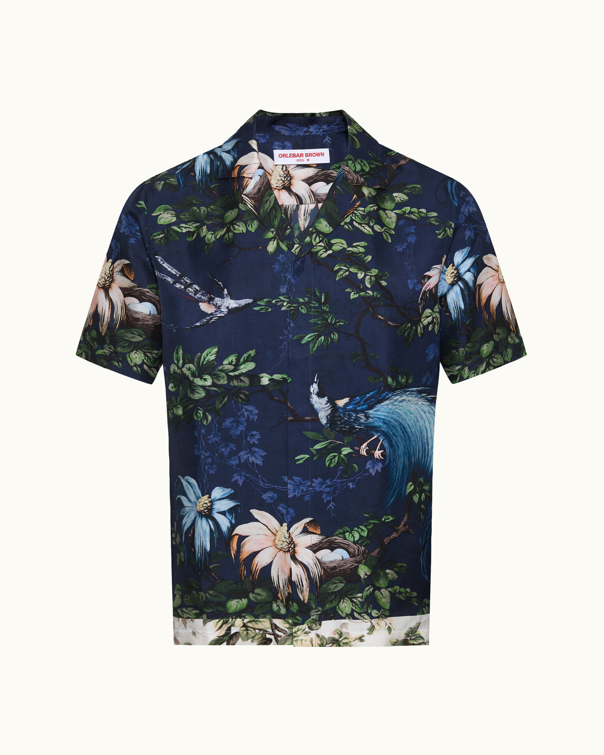 Navy blue shirt with floral and bird pattern on a white background