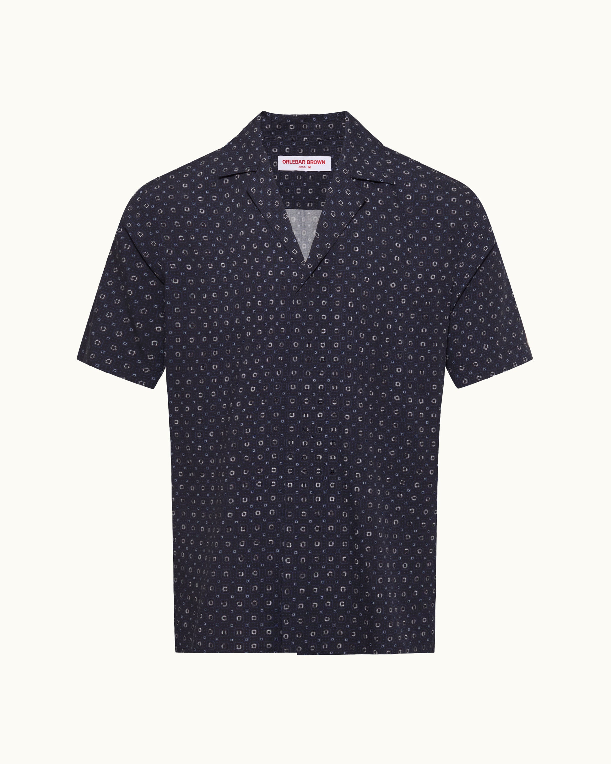 Navy blue polo shirt with white pattern on a white background