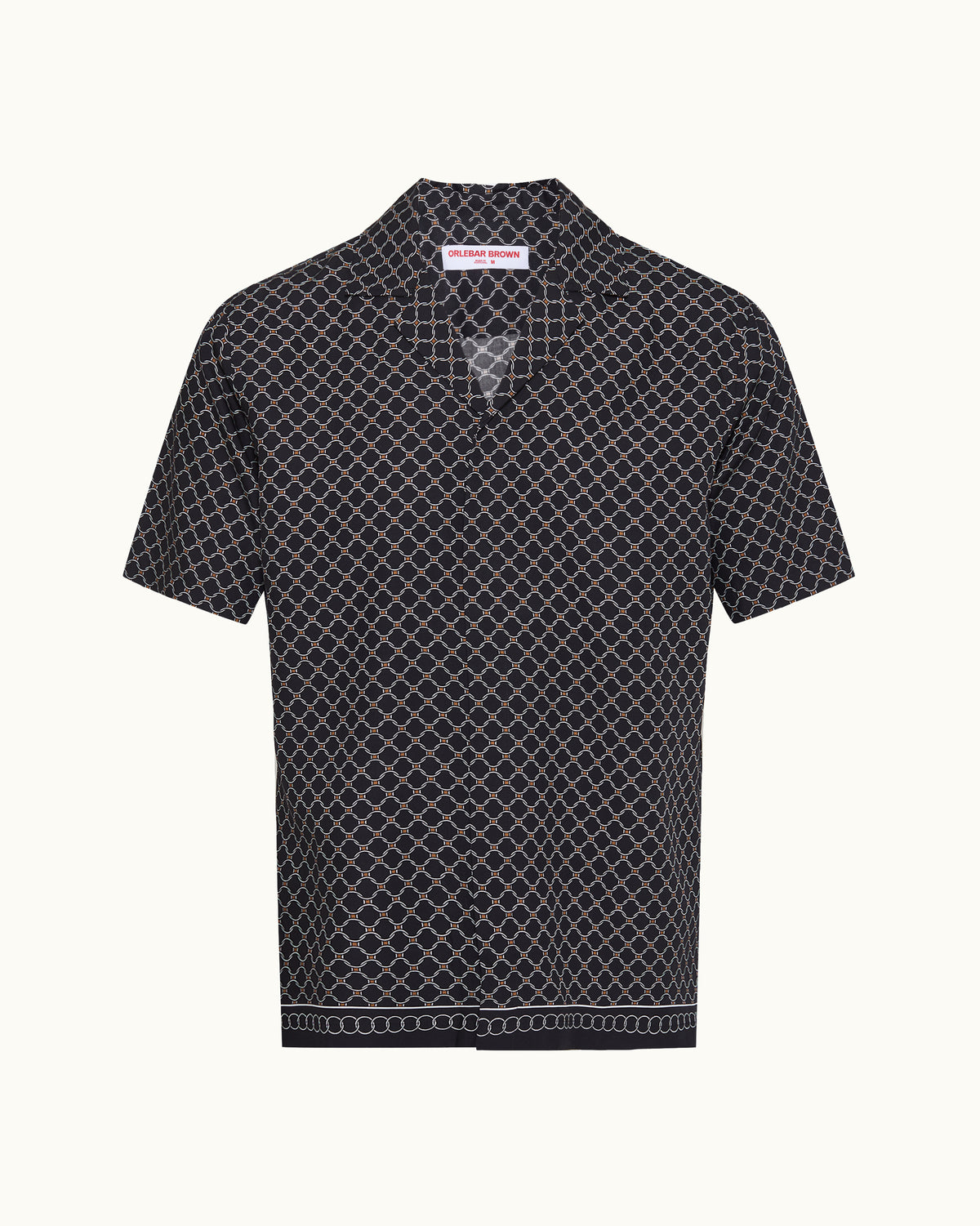 A short-sleeve button-up shirt with a black base and a white geometric lattice pattern, featuring a pointed collar and a decorative border on the hem, shown against a plain off-white background.