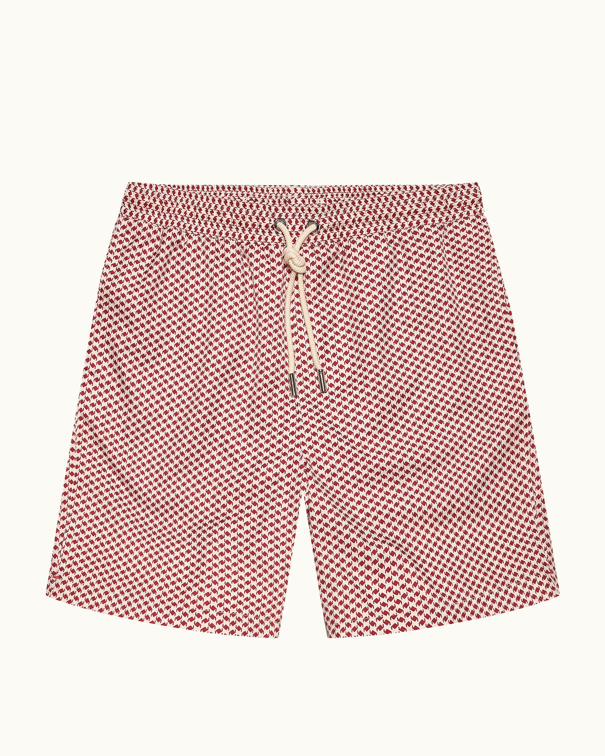 Red patterned shorts with a drawstring on a white background