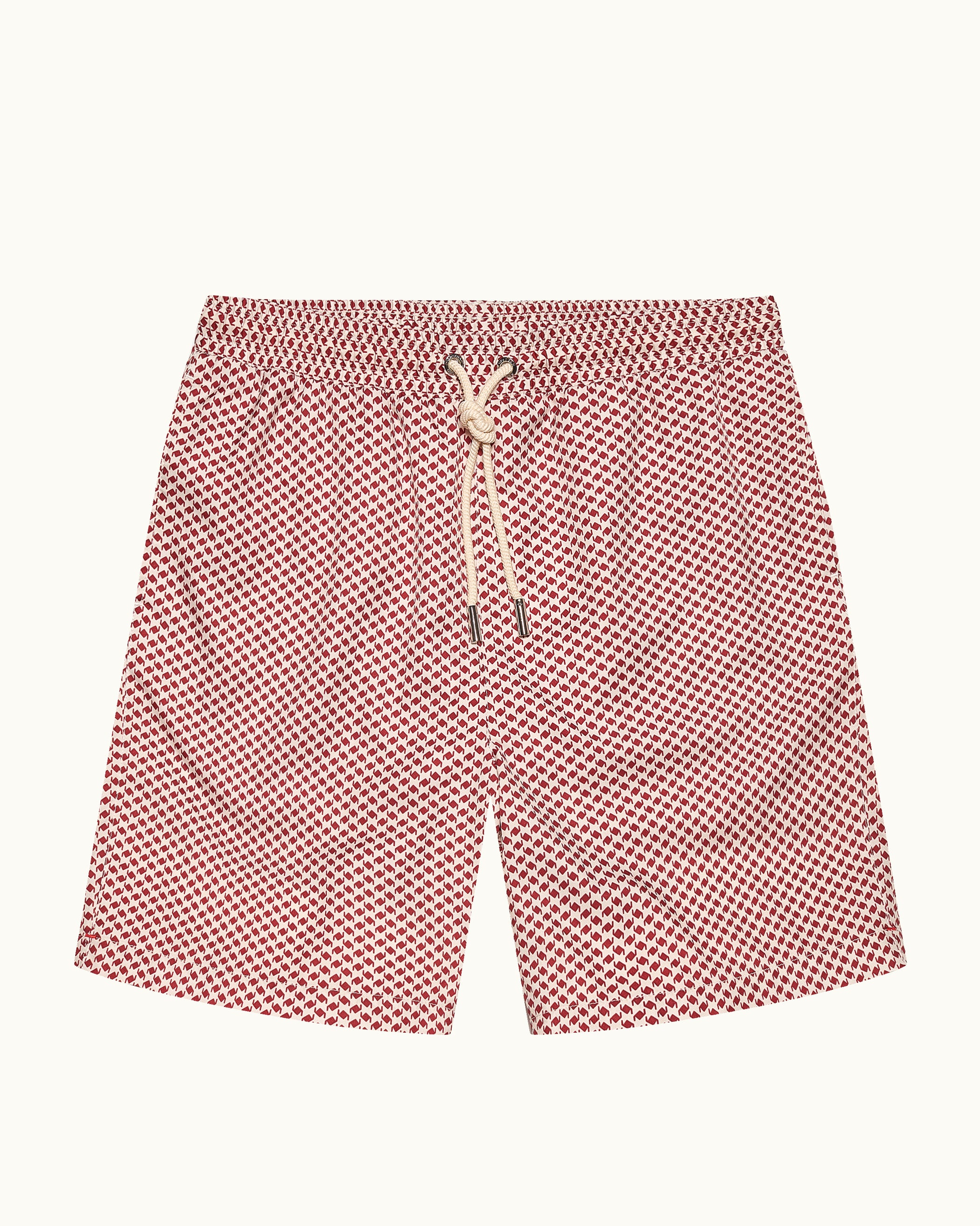 Red patterned shorts with a drawstring on a white background